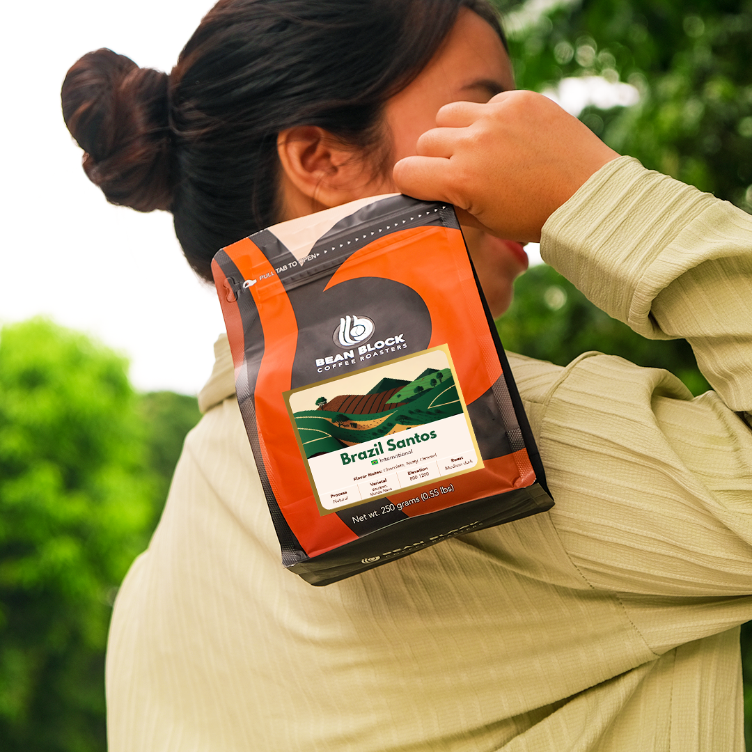 Coffee Bean Pouch of Brazil Santos Coffee Beans in Bean Block Coffee Roasters 250g pouch roasted in Philippines. Lifestyle style of shot holding the Bean Block coffee pouch