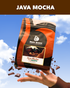 Bean Block Coffee Roasters Java Mocha 250g mocha flavored coffee package with a hand holding it against a blue sky background.