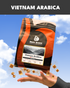Bean Block Coffee Roasters Vietnam Arabica Dark roast 250g coffee package with a hand holding it against a blue sky background.